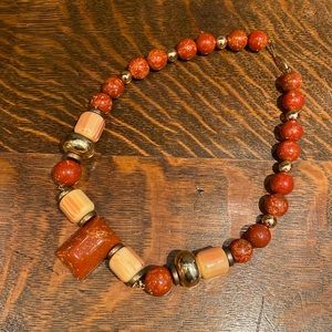 21.5” orange, ivory-colored and gold-tone beaded necklace
